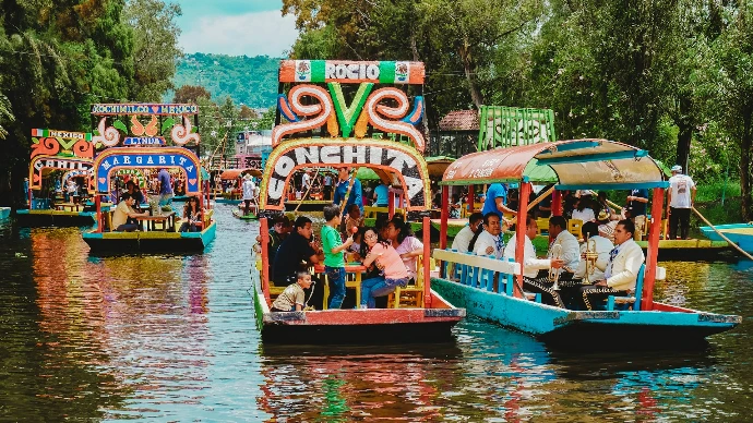 people riding tour boats during daytime