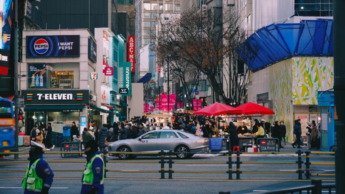 A busy city street scene with people.