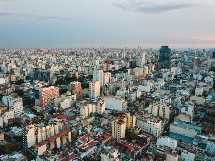 aerial view of city under cloudy sky during daytime